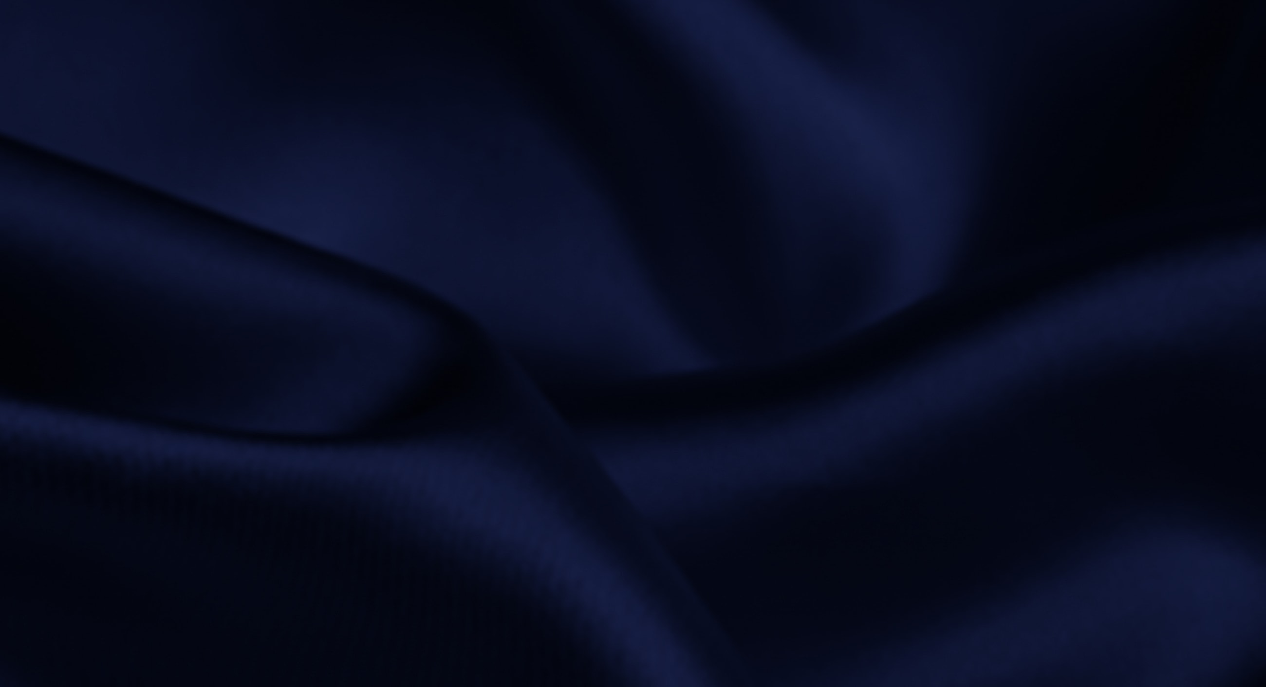 Navy blue satin fabric background texture.