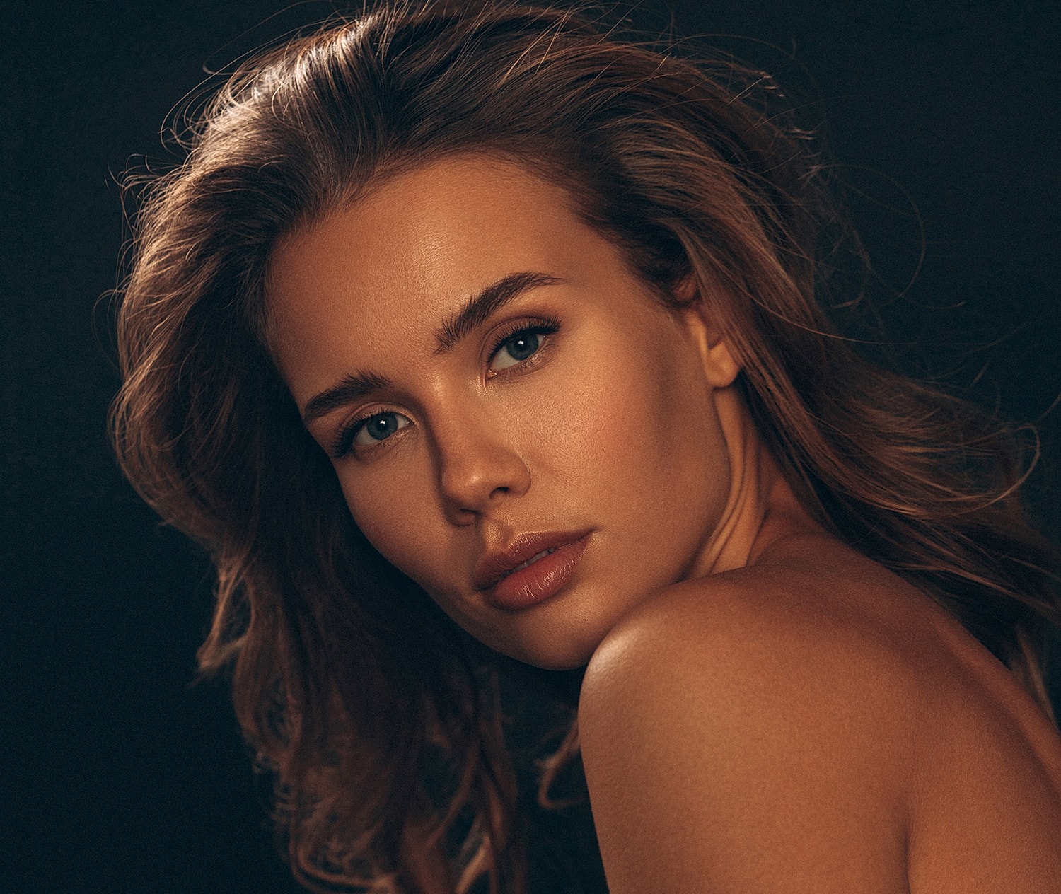 Portrait of a Houston plastic surgery model with flowing hair.